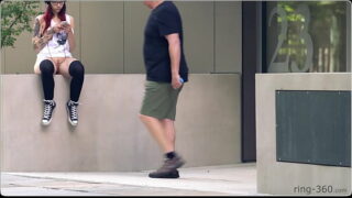 Brown-haired woman with skateboard flashing in public